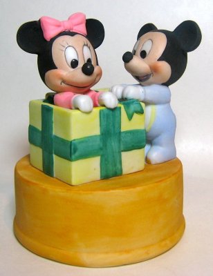 Baby Mickey Mouse opens gift with Minnie Mouse inside bisque Disney Christmas figurine