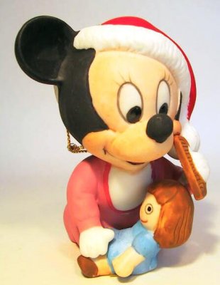 Baby Minnie Mouse combing her doll's hair ornament