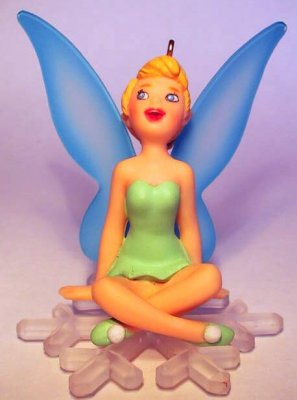 Tinker Bell sitting on snowflake ornament (Grolier)