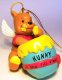 Winnie the Pooh as angel eating hunny from pot ornament (Grolier)