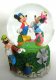 Goofy directs Mickey and Minnie in a movie musical snowglobe