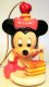Baby Minnie Mouse with cake ornament