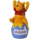 Winnie the Pooh sitting on hunny pot magnetized salt & pepper shaker set