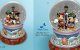 Caroling for the holiday musical snowglobe