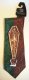 Jack Skellington in coffin necktie, green & brown background